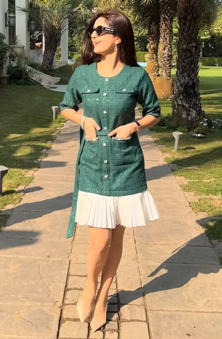 Aaina Khanna in Green Tweed Pleated Hem Dress