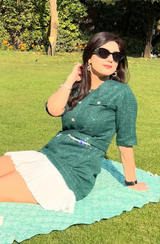Aaina Khanna in Green Tweed Pleated Hem Dress